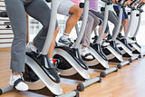 Low section of people working out at spinning class
