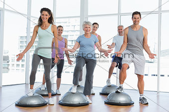 Full length portrait of people doing power fitness exercise