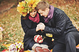 Great relationship. Young sweet couple having date in autumn park.