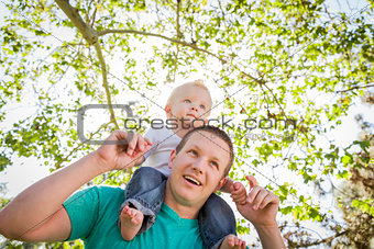 Cute Young Boy Rides Piggyback On His Dads Shoulders