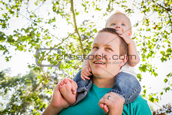 Cute Young Boy Rides Piggyback On His Dads Shoulders