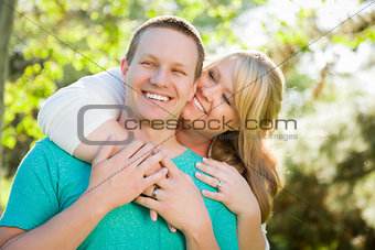 Young Attractive Couple Hugging in the Park