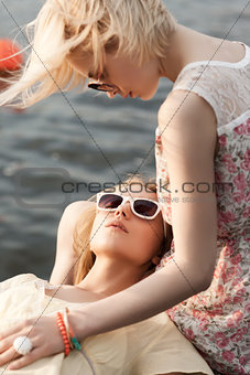 two beautiful girls at sea pier