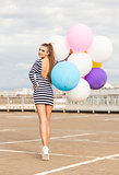 beautiful lady in short black and white striped dress holds bunc