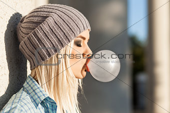 Beautiful blonde girl in beanie hat with smokey eye make up who 