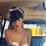 a beautiful retro-looking girl with blue eyes and red lips throu