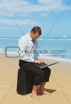 businessman  on the beach 