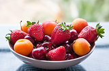 Assorted colorful fresh summer berries and fruits