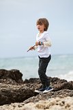 young little boy child playing outdoor sea beach vacation