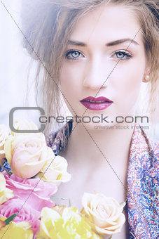 attractive young woman with pink roses