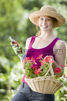 Smiling pretty woman gardener