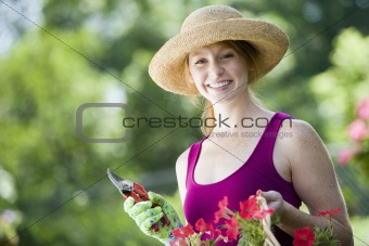 Smiling pretty woman gardener