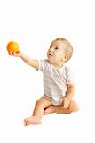 baby boy giving an orange over white