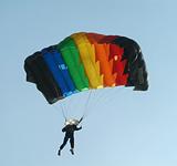 Parachutist with colourful parachute