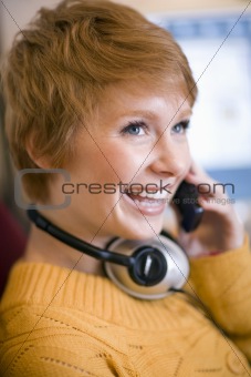 Woman on cell phone with headphones