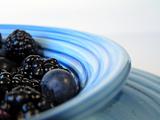 berries in blue bowl 