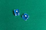 Blue Casino Dice with Snake Eyes showing.