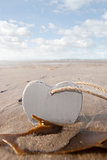 lone wooden love heart in the sand