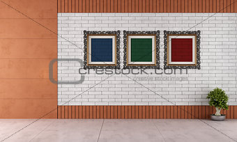 Empty room with white brick wall and classic frame