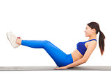 Woman doing abdominal crunches on exercise