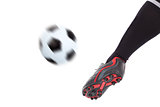 foot kicking soccer ball 