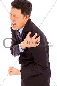 businessman having shoulder pain and painful expression