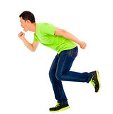 Young happy man make a running pose