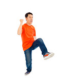 asian young man is dancing happily