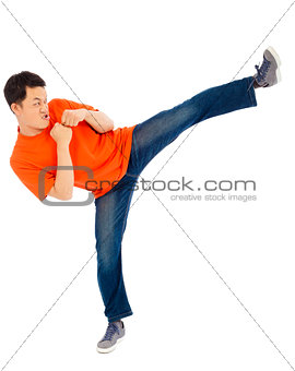 young man imitate a Karate to do standing side kick