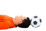 smiling young man lying down with soccer