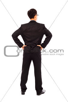businessman standing and put hand on waist.