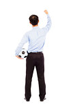 Back view of young businessman hold a ball