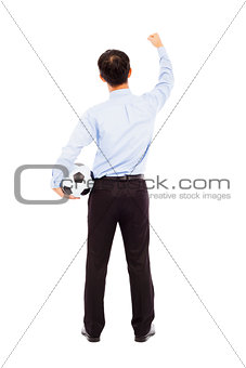 Back view of young businessman hold a ball