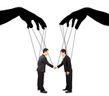 black hands shadow control two businessman actions