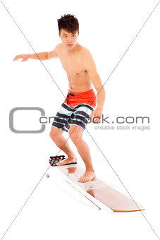 young  surfer simulate surfing pose