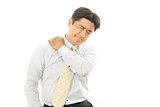 Businessman with shoulder pain