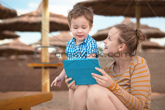 Little boy with is mother at a beach resort