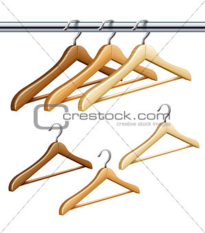 Wooden coat hangers on the tube for wardrobe clothes