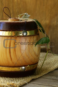 wooden barrel for products on wooden background