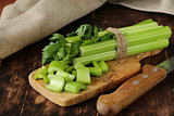 chopped green celery on a kitchen wooden board