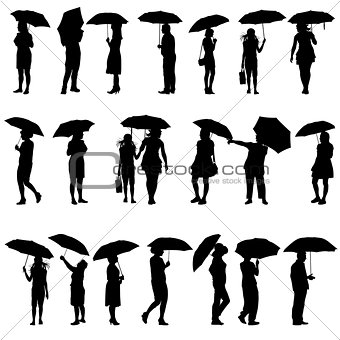 Set of black silhouettes of men and women with umbrellas. Vector