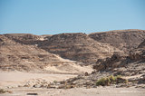 Dry river valley through a rocky desert