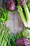 Green vegetables and old wood background