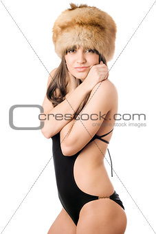 woman in swimsuit and fur-cap