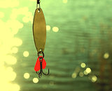 fishing lures over water with beautiful bokeh
