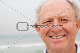 Happy old man posing to camera