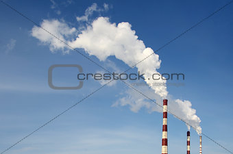 industrial smoke from chimney on sky