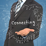 Man in suit holding word "connecting"