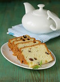 sliced ​​cake with raisins on the plate