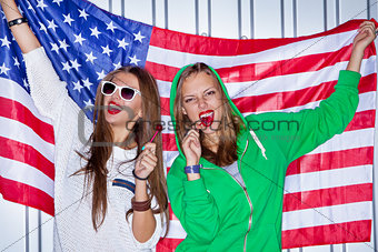 Beautiful patriotic girls with lollipop